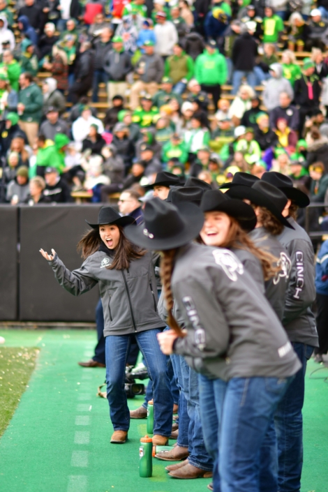 CU Buff's Ralphie Handlers celebrating at a football game