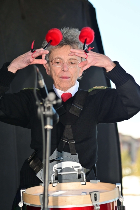 Person playing musical instrument during an event.