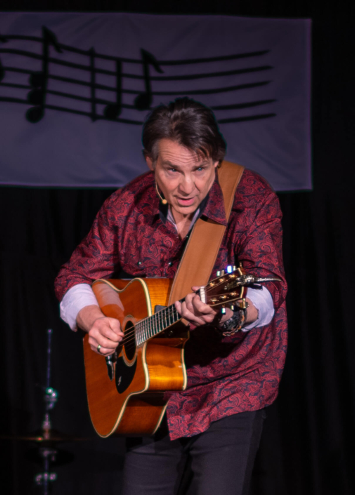 Local musician playing the guitar during an event